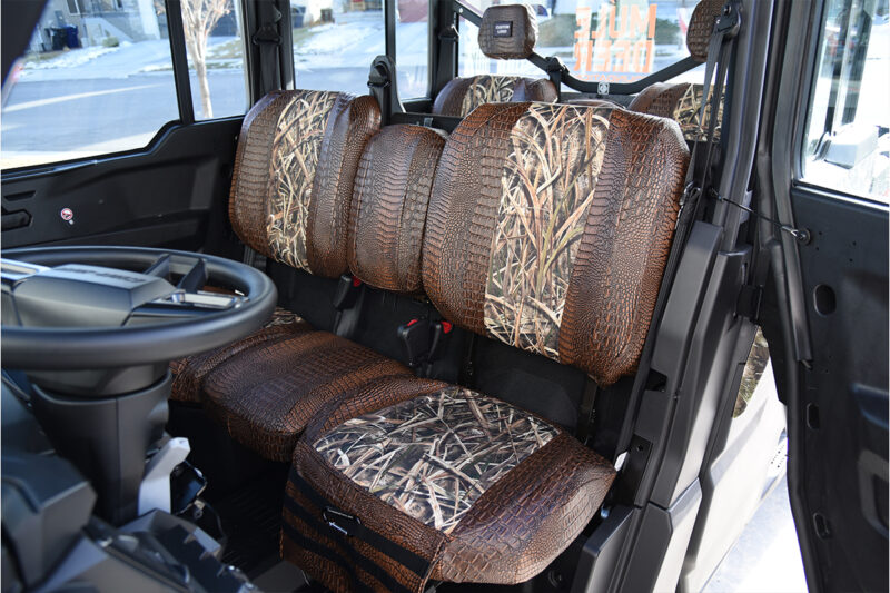 2026 Can-Am Defender front seats with Mossy Oak Shadow Grass Blades inserts and Java Croc trim