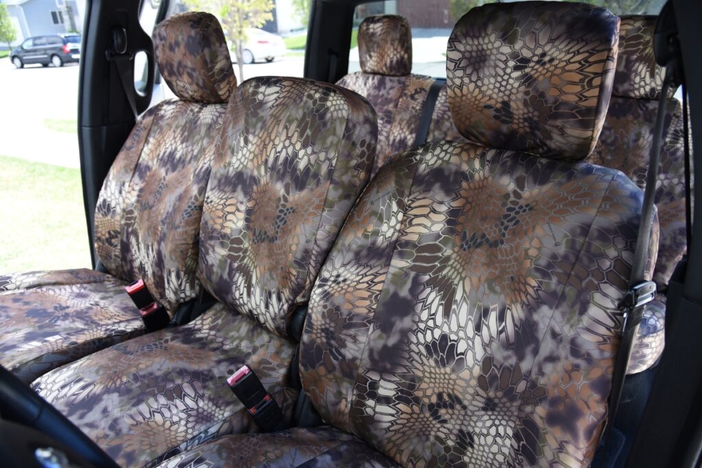 Folded rear seat covers in Mossy Oak NB Country camouflage for Nissan Frontier