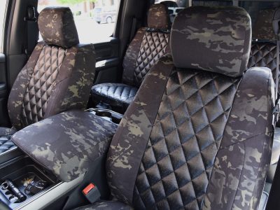 2021 RAM 1500 | Black Ostrich E01 Diamond | MultiCam Black C80 2018 RAM 1500 front seat covers in MultiCam Black camouflage with Black Ostrich Diamond inserts