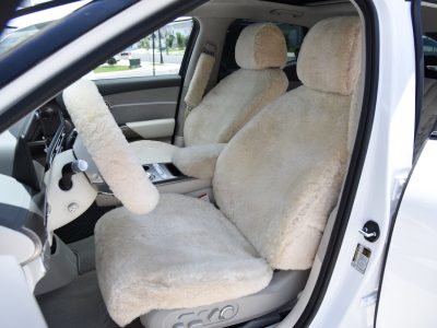 2023 Genesis GV60 front Sand (Pearl) sheepskin seat covers with matching sheepskin steering wheel cover