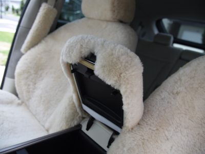 2023 Genesis GV60 front Sand (Pearl) sheepskin seat covers with matching sheepskin steering wheel cover