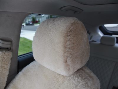 2023 Genesis GV60 front Sand (Pearl) sheepskin seat covers with matching sheepskin steering wheel cover