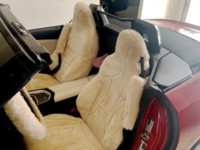 2025 BMW Z4 front Sand (Pearl) sheepskin seat covers with matching sheepskin steering wheel cover