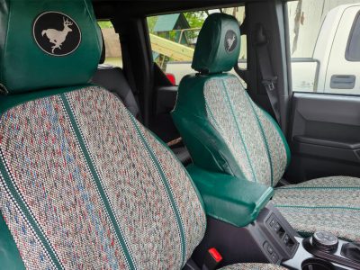 2024 Ford Bronco Green Saddle Blanket front seat cover close-up showing fabric texture and custom fit