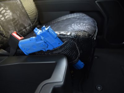 2025 GMC Sierra 3500 Kryptek Typhon seat cover with Midnight Croc trim and pistol holster