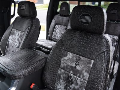 <b>2025 Chevy Silverado 2500
</b><br>
Insert: Kryptek Raid (Canvas)
</br>Trim: Ebony Croc (Sim. Leather)
<br>Product: Exotic - Gold Series </br> | Covers and Camo