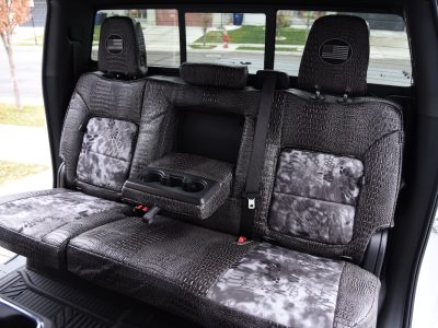 <b>2025 Chevy Silverado 2500
</b><br>
Insert: Kryptek Raid (Canvas)
</br>Trim: Ebony Croc (Sim. Leather)
<br>Product: Exotic - Gold Series </br> | Covers and Camo