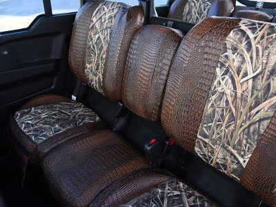 2026 Can-Am Defender front seats with Mossy Oak Shadow Grass Blades inserts and Java Croc trim