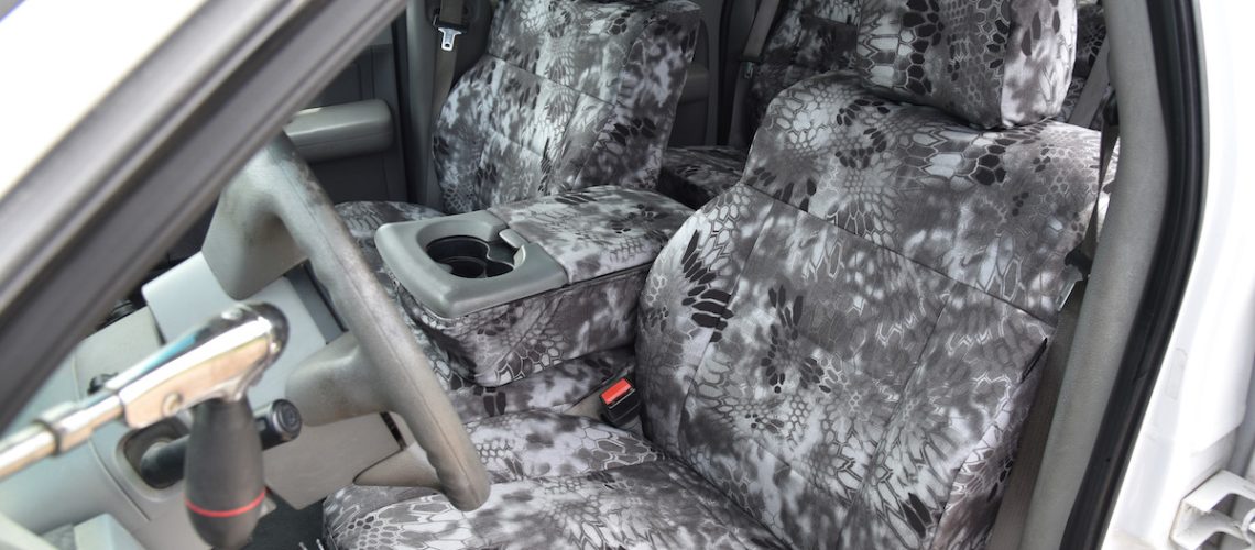 2005 Ford F-150 front Kryptek Raid seat covers with matching Kryptek Raid trim